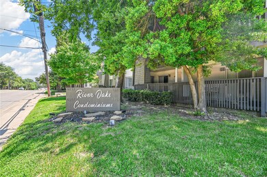 Community / neighborhood sign with a lawn