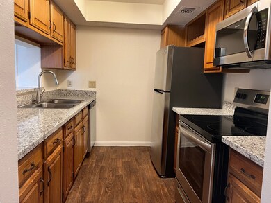 Galley kitchen was updated in 2023 with granite co