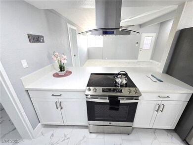 Kitchen with marble finish floor, stainless steel