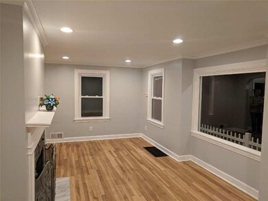 LIVING ROOM DISPLAYING ALL NEW WINDOWS.