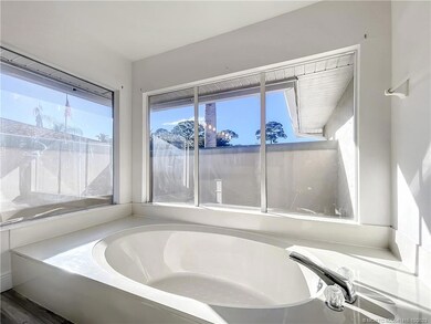 LARGE MASTER BATHROOM WITH ROMAN TUB. WALK IN CLOS