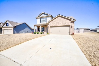 View of front of house featuring brick siding, an 