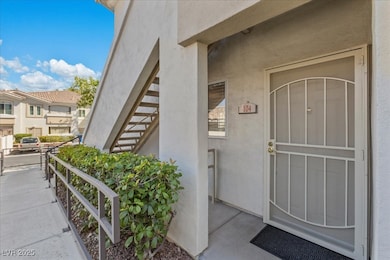 Property entrance with stucco siding and a residential view