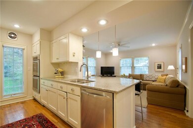 A classic kitchen with breakfast bar, subway tile,
