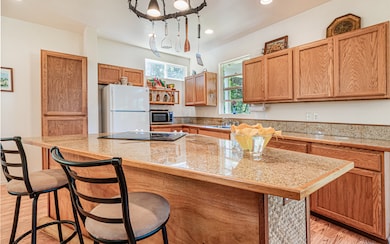 Solid Oak cabinets and Colorado Gold Granite tile countertops will stand the test of time!