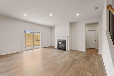 Unfurnished living room featuring recessed lightin