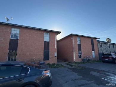 View of property exterior with brick siding