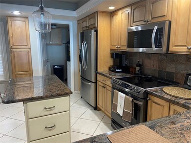 Kitchen with adjacent laundry room