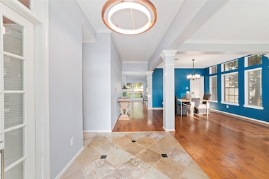 This home features a bright, open entrance with el
