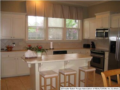 Kitchen with island and stainless appliances