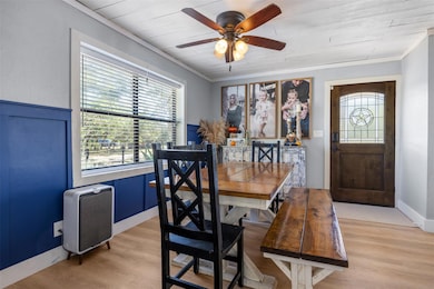 Dining area with light wood finished floors, orna