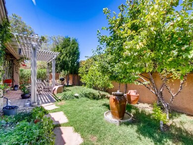 Covered Patio with Shade Structure. Pavers, Grass,