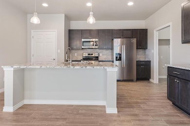 Kitchen featuring appliances with stainless steel