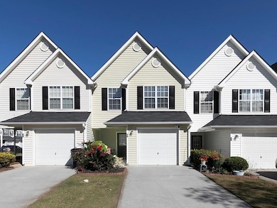 Traditional home with concrete driveway and a garage