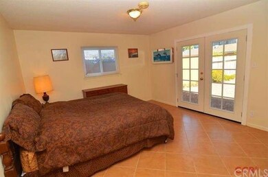 Clean Main Bedroom has upgraded French doors acces