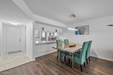 Dining space featuring baseboards and wood finishe