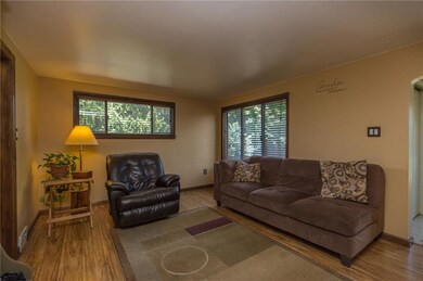 The living room boasts newer laminate floors and l