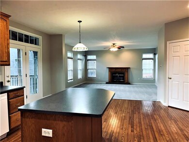 View from kitchen of sunken family room and the ha