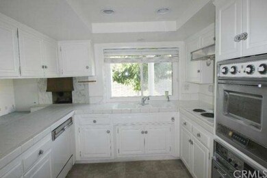 Working in the kitchen is a delight. You have a nice view of the back yard, and it's open to the family room.