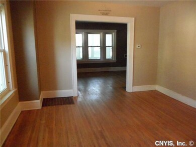 Dining Room Hardwood floors and new windows throug