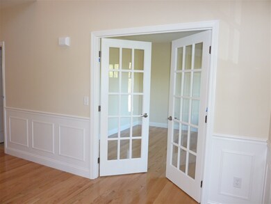 Study with French doors and hardwood floors