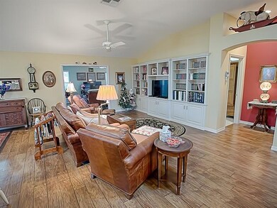 A wall of built-ins in the living room and access 