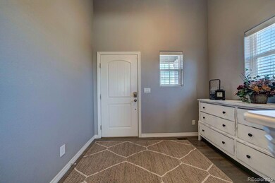 Wide Entry with wood floors and high ceilings