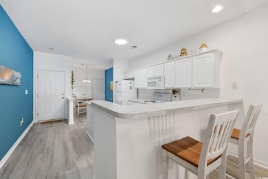 Kitchen featuring light wood finished floors, ligh