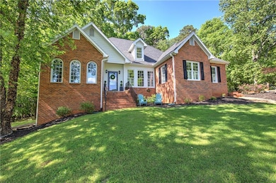 View of front of home featuring brick siding, a fr