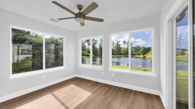 Unfurnished sunroom featuring a water view