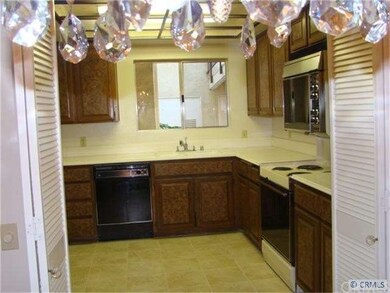 Kitchen has new paint & tile floor