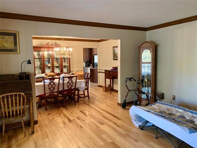 Living Room is open to the Dining Room which flows