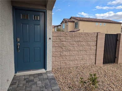Entrance to property featuring stucco siding