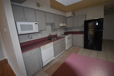 This kitchen layout is compact and functional.