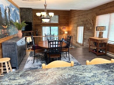 Open living space.  The walls are handsome knotty