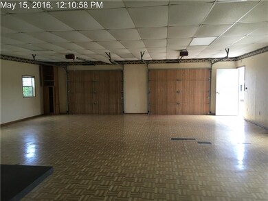 Workshop view of overhead garage doors with garage