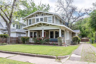 View of front facade with a front yard and a porch
