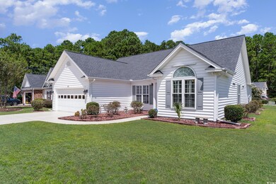 Single story home featuring a garage and a front l