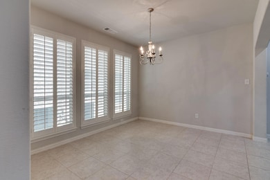 Unfurnished room with an inviting chandelier and l