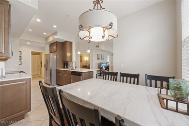 Dining room with recessed lighting, a chandelier,