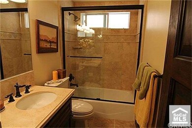 Bathroom with travertine finish