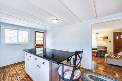 65 Kitchen and side door to living room