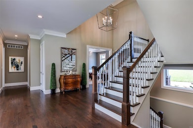 Elegant main staircase to three ensuite upper leve