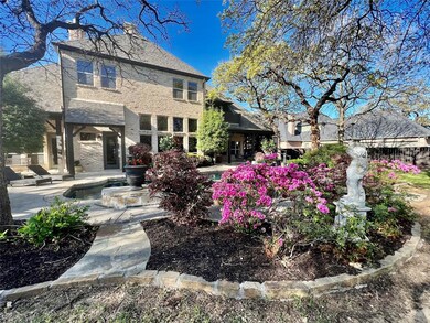 ENTER TO A GENEROUS FOYER AND A SWEEPING STAIRCASE TO THE SECOND LEVEL
