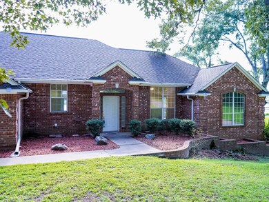 Ranch-style house with a front lawn