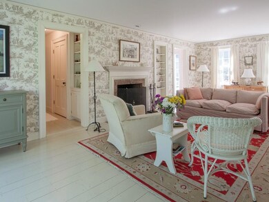 The living room with fireplace runs...