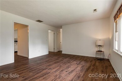 Upstairs living room towards kitchen.