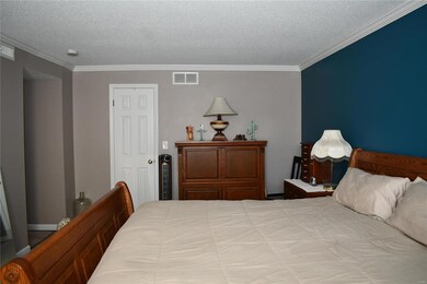 Here is a photo of the Master Bedroom. The door in