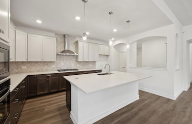 Bright kitchen with ample cabinet space  with over