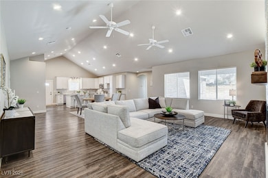 Living room featuring extensive canned lighting, c